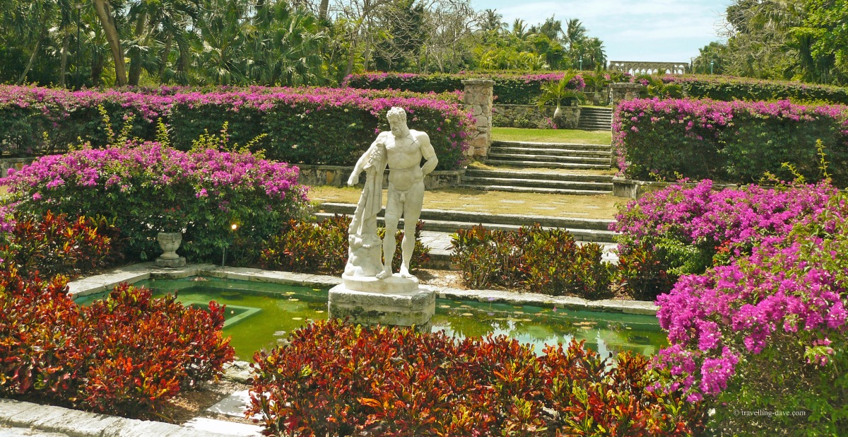 Flowers and a statue at Versailles Gardens in the Bahamas