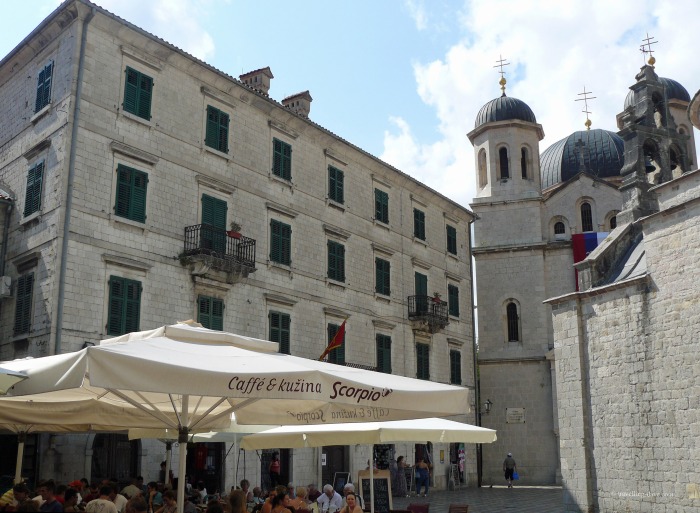 View of a cafe and a church in Kotor