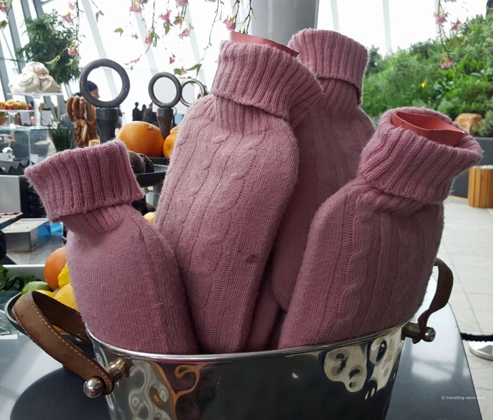 View of pink water bottles in a basket