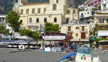View of the beach and the cathedral in Positano