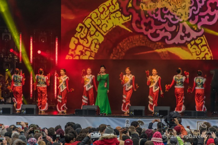 Colourful dressed singers on stage for Chinese New Year